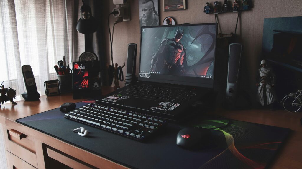 a gaming laptop sitting on top of a desk