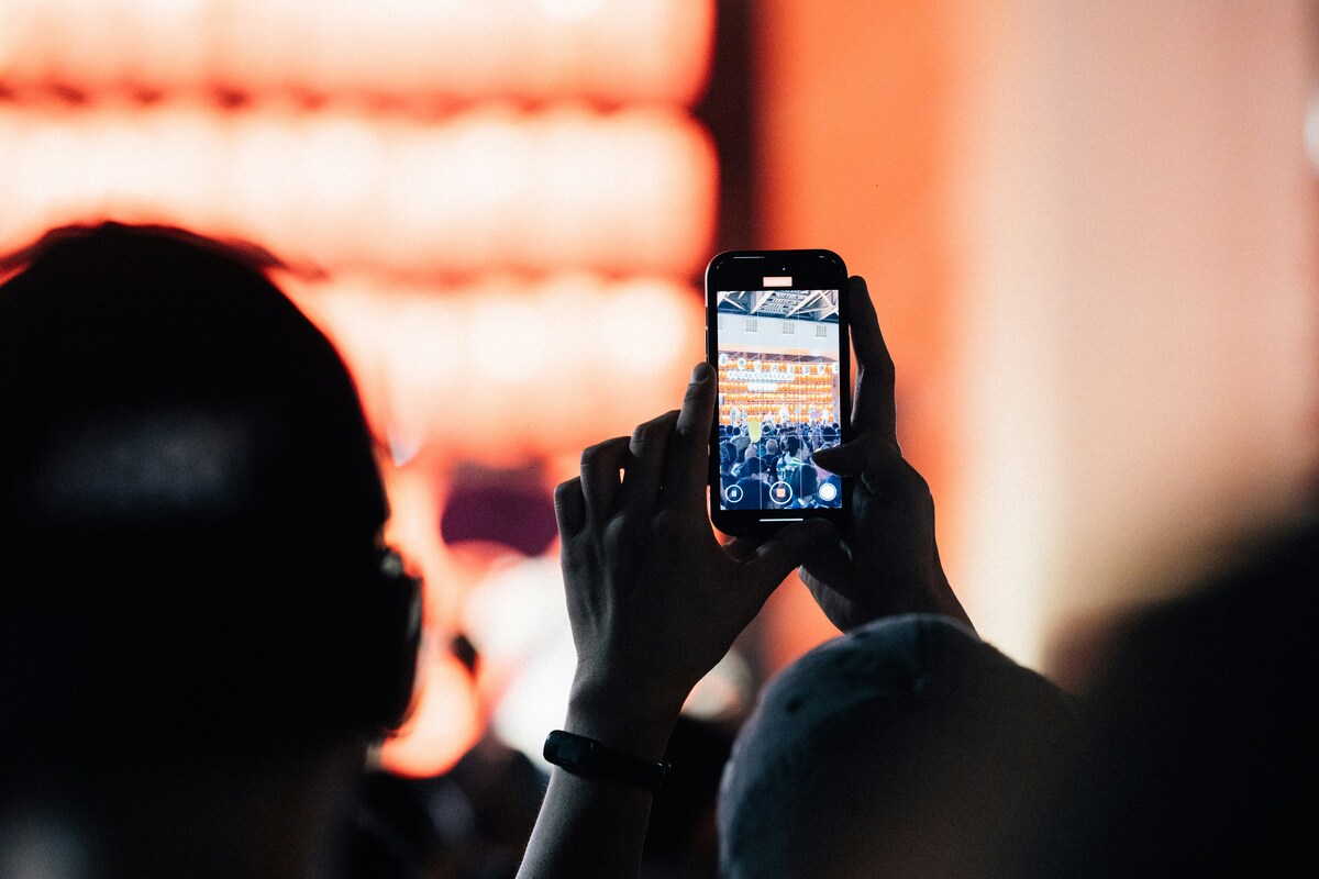 Person using a phone during an event